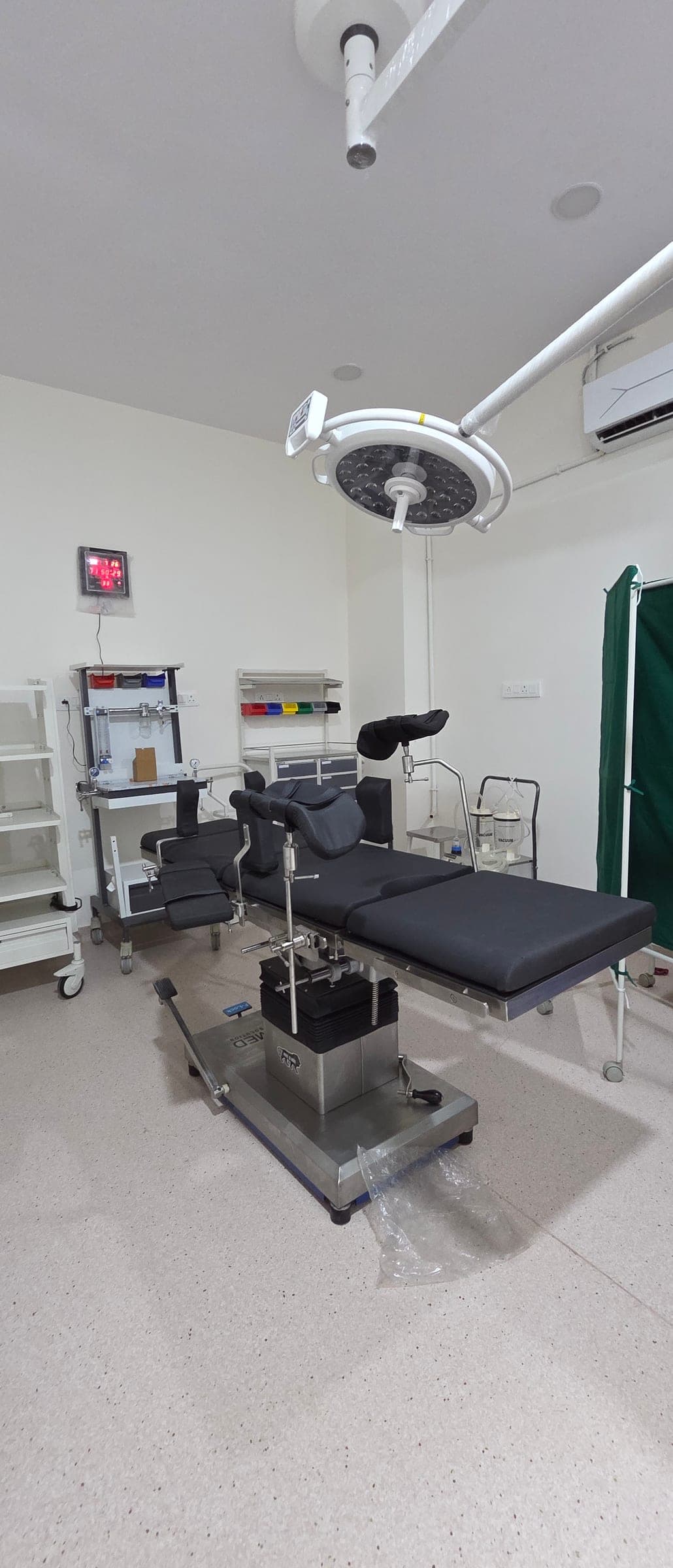 Modular operation theatre with surgical light and operating table at Krisha Women's Hospital