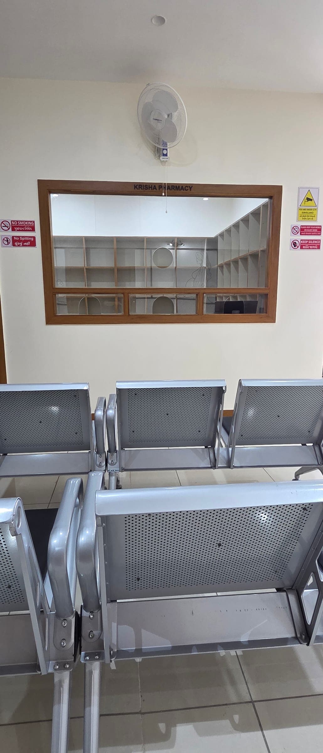 In-house Krisha Pharmacy counter and attendant seating at Krisha Women's Hospital